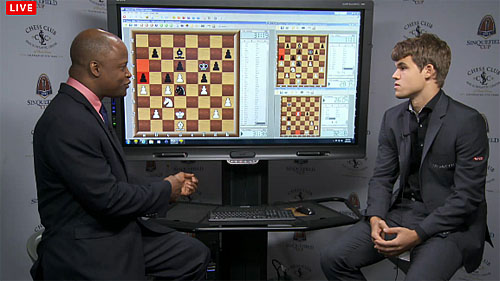 GM Maurice Ashley discussing second round draw with Carlsen. Ashley also asked him about his first baseball experience.