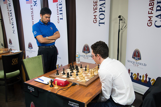 Topalov gives Caruana something to think about while Nakamura looks on.