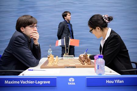 Maxime Vachier-Lagrave versus Hou Yifan, 1-0. Photo by Alina L'Ami.