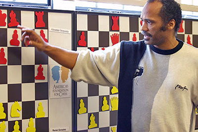 Emory Tate analyzing his win over Varuzhan Akobian. Photo courtesy of John Henderson