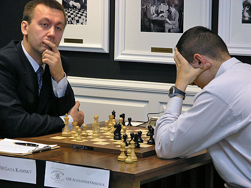 GM Gata Kamsky in a pensive pose while Alexander Onischuk ruminates. Photo by Daaim Shabazz.