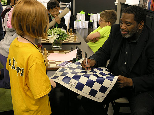 Local legend Charles Lawton interacting with kids. Photo by Daaim Shabazz.