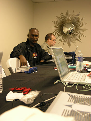 Daaim Shabazz and John Henderson in the press center. Photo by Jared.