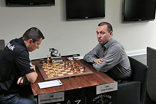 Alexander Onischuk faces off against leader Gata Kamsky, 1/2-1/2.