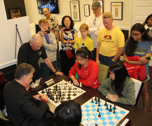 Women's participants playing bughouse with GM Yasser Seirawan.