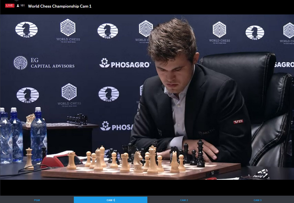 Carlsen ponders move after Karjakin's 15.Qf3