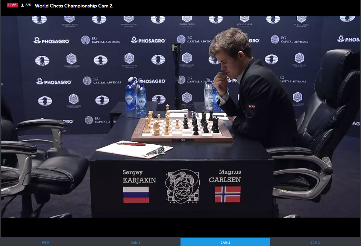 Carlsen ponders move after Karjakin's 15.Qf3