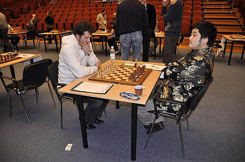 Bacrot of France pondering his strategy against China's Wang Yue.