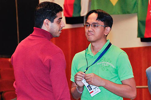 Eshan Ghaem Maghami (Iran) chats with fellow-GM Darwin Laylo (Philippines) before action starts.