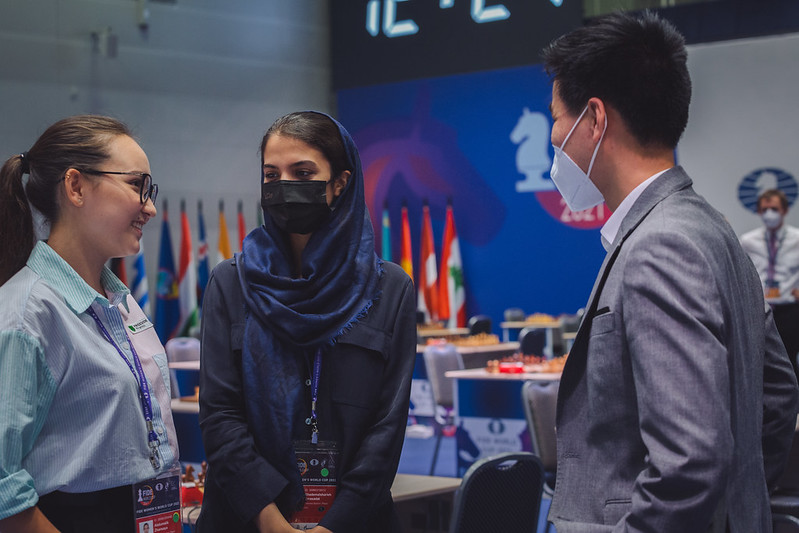 Two very close friends Zhansaya Abdumalik (Kazahkstan) and Sarasadat Khademalsharieh (Iran) chat before the round. Photo by Anastasia Korolkova