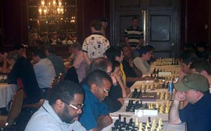 FM 'Pete' Rogers and IM-elect Stephen Muhammad do battle while FM William Morrison is four boards down. Copyright  2003, Daaim Shabazz.