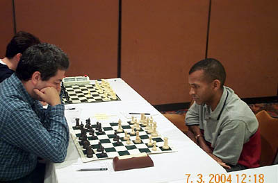 GM Vitali Golod vs. IM-elect Stephen Muhammad, -. Copyright  2004, Daaim Shabazz.