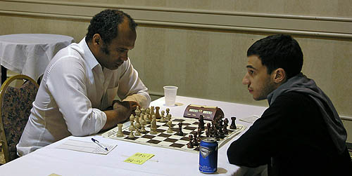 Laurent Fressinet of France (right) was toppled by Emory Tate in an exciting 5th round battle. The French star was not able to gain momentum after early struggles. Photo by Daaim Shabazz.