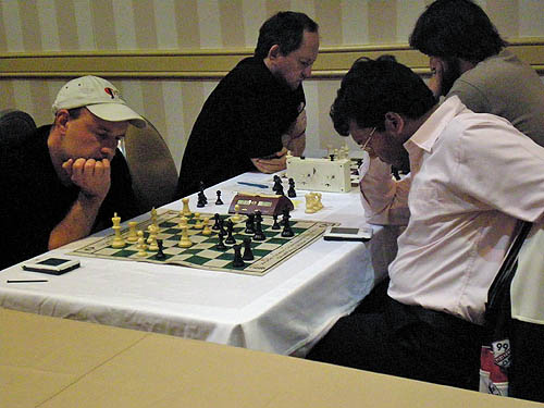 Alexander Shabalov seems to be in trouble against Surya Ganguly, but prevails. Unfortunately, Shabalov suffered a first-round upset and hurt his momentum. Ilya Smirin faces Jiri Stocek in the background.