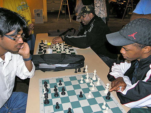 Siddarth Ravichandran of India analyzing his game with Zimbabwe's Farai Mandizha. Ravichandran got an IM norm at the Philadelphia International and got 7-2 at the World Open in the under-2400. Photo by Daaim Shabazz.