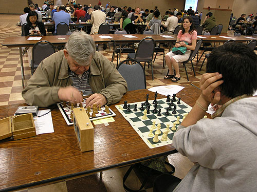 Visually-impaired player using special board and a tape recorder for the moves. Photo by Daaim Shabazz.