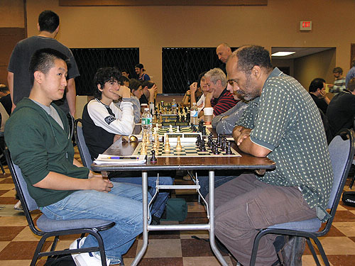 FM Victor Shen playing IM Emory Tate on top board in under-2400 section. Photo by Daaim Shabazz.