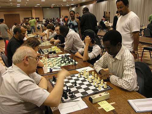 Top boards in under-2400 section. Epic battle unfolds between IM Emory Tate and IM Oladapo Adu. A surging IM-elect Farai Mandizha enroute to a last round win against FM Ilye Figler. Photo by Daaim Shabazz.