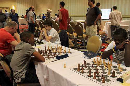 James Black, Jr. is on the move while Justus Williams shows intensity. Photo by Daaim Shabazz.