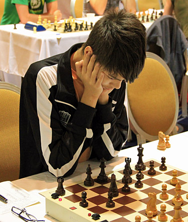 GM Ray Robson ponders his next move. Photo by Daaim Shabazz.