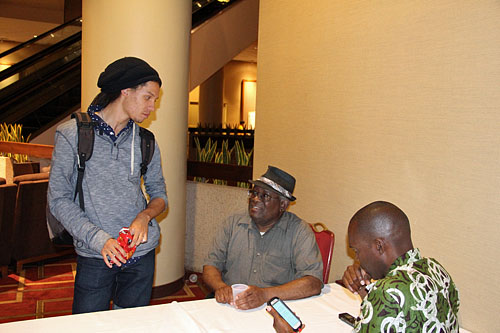 IM Kassa Korley chatting with Walter Harris. Photo by Kimani Stancil.