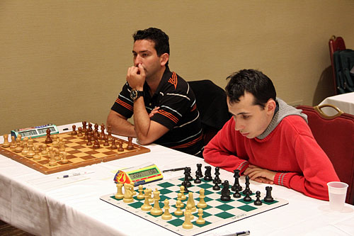 Yuniesky Perez and Alex Lenderman wait on opponents. Photo by Daaim Shabazz.