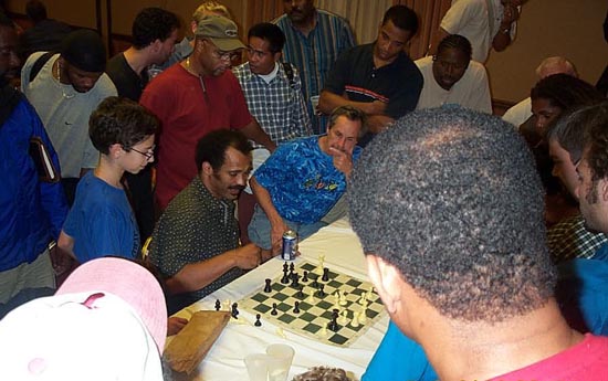 Tate showing his IM title-clinching game with GM Alonso Zapata.