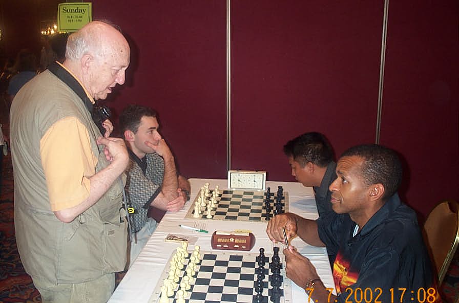 Jerry Bibuld discussing norm possibilities with FM Muhammad. Photo by Daaim Shabazz.